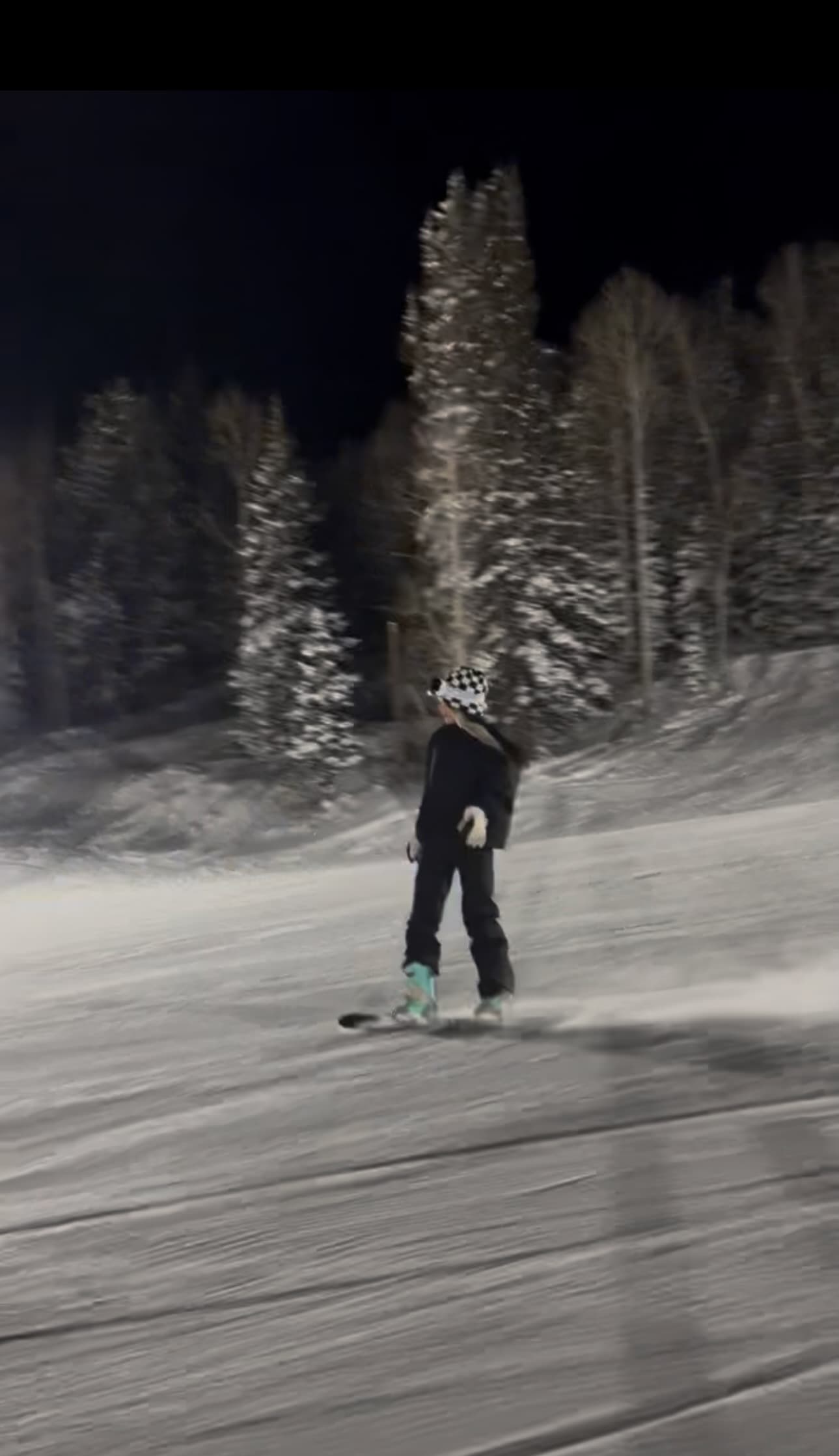 Blaire snowboarding at night